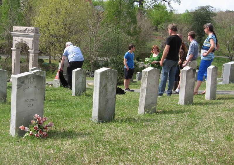 Karl decorates grave